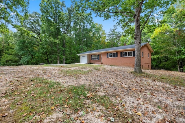 ranch-style house featuring a garage