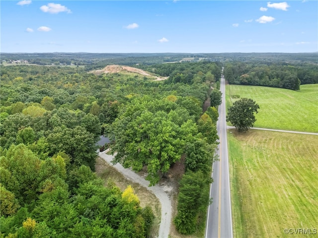 birds eye view of property with a rural view