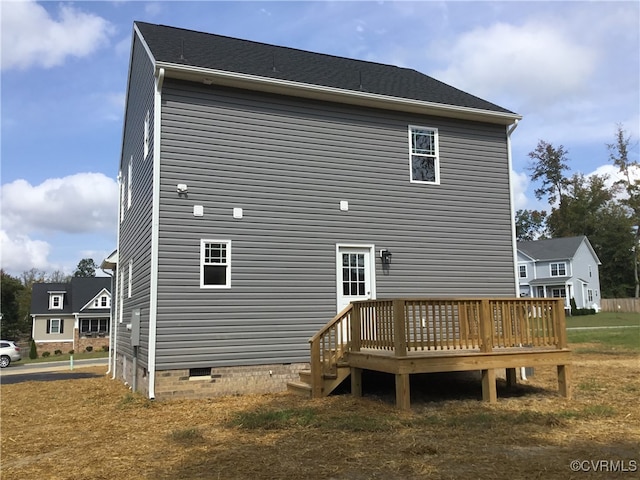 back of house with a deck