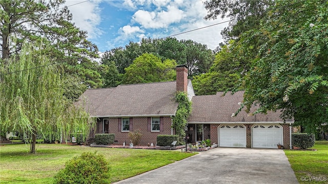 view of front of property with a garage and a front yard