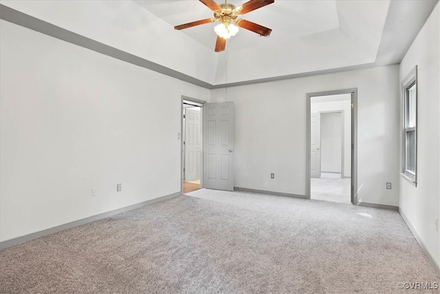 unfurnished bedroom with ceiling fan and light colored carpet