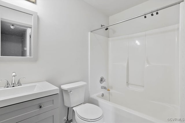 full bathroom with  shower combination, vanity, and toilet