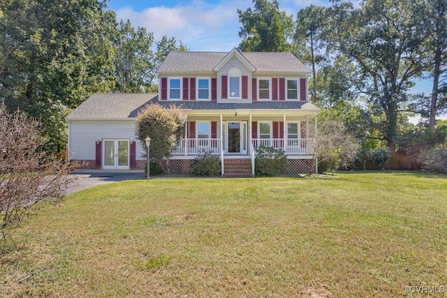 colonial home with a front yard and a porch