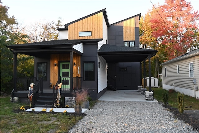 view of front of property with a carport and a porch