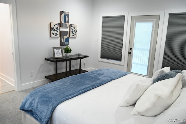 bedroom featuring carpet and access to outside