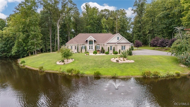 view of front of house featuring a water view and a front yard