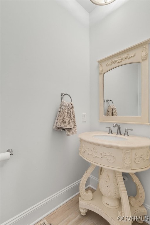 bathroom with wood-type flooring