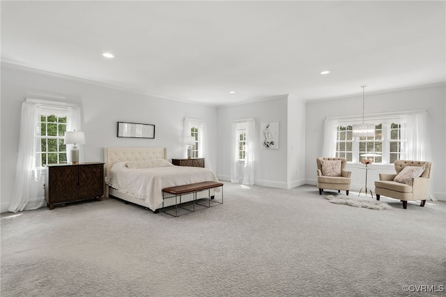 bedroom with ornamental molding, a chandelier, and carpet flooring