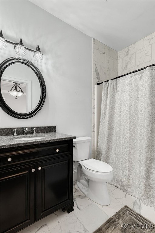 bathroom featuring walk in shower, vanity, and toilet