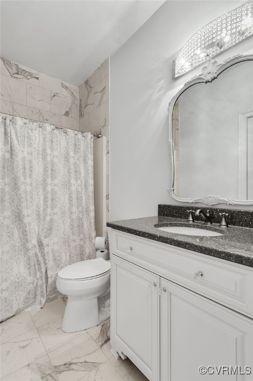 bathroom with curtained shower, vanity, and toilet