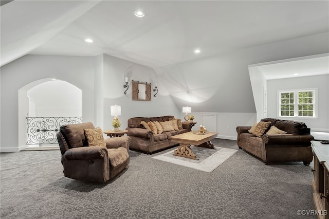 carpeted living room featuring vaulted ceiling