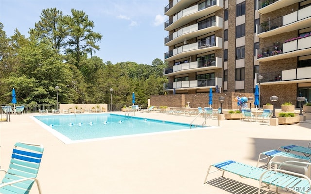 view of pool featuring a patio area