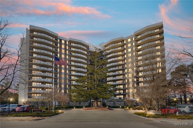 view of outdoor building at dusk