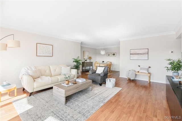 living room featuring ornamental molding and hardwood / wood-style floors