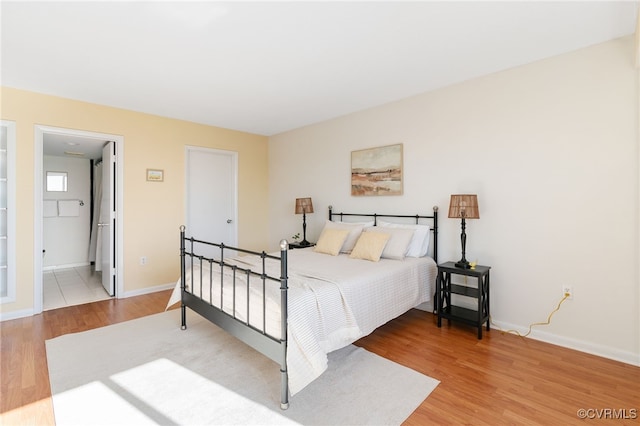 bedroom with hardwood / wood-style flooring