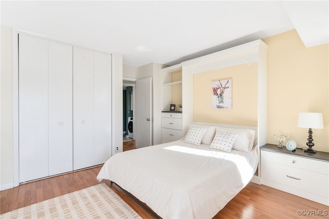 bedroom featuring a closet and light hardwood / wood-style flooring