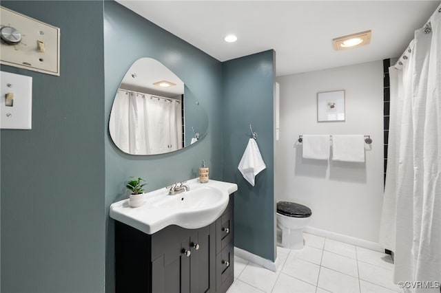 bathroom with vanity, tile patterned floors, and toilet