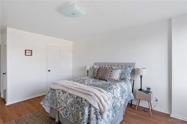 bedroom with hardwood / wood-style flooring