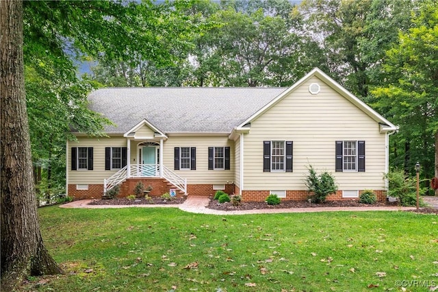 single story home featuring a front lawn