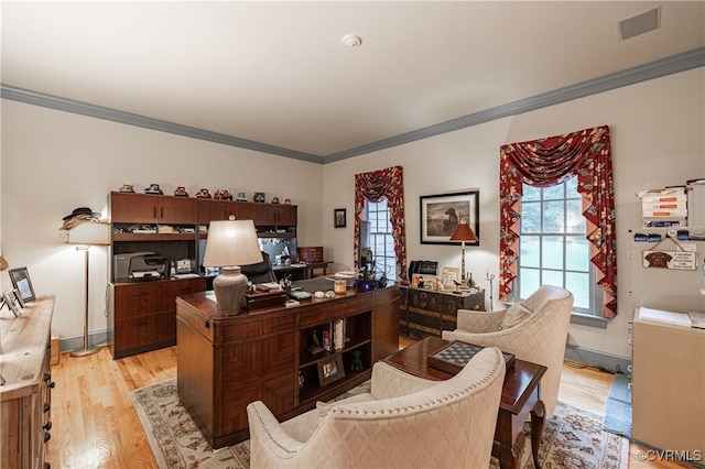 home office featuring crown molding and light wood-type flooring