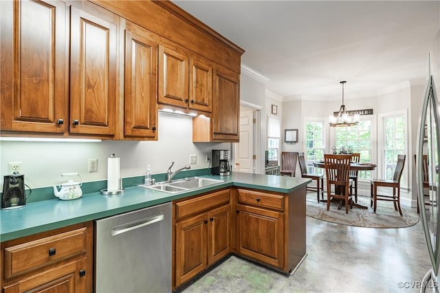 kitchen featuring pendant lighting, sink, ornamental molding, stainless steel appliances, and an inviting chandelier