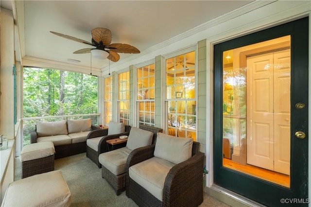 sunroom with ceiling fan