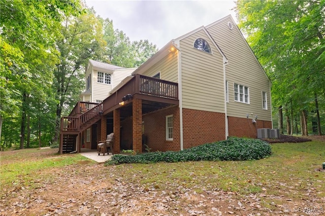 view of property exterior with a deck and a patio