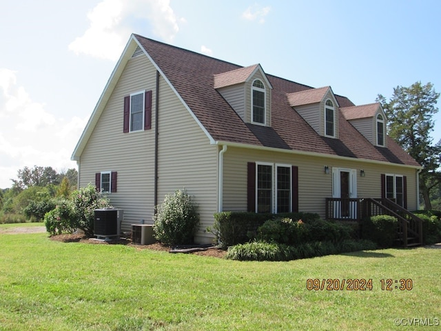 exterior space with a yard and central AC unit