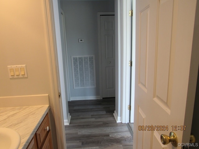 bathroom featuring vanity and hardwood / wood-style flooring