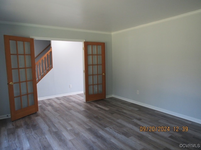 empty room with ornamental molding, hardwood / wood-style flooring, and french doors