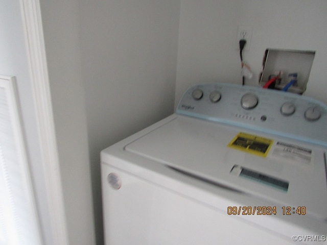 clothes washing area featuring washer / dryer