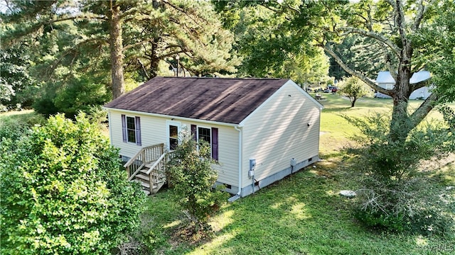 view of outbuilding featuring a lawn