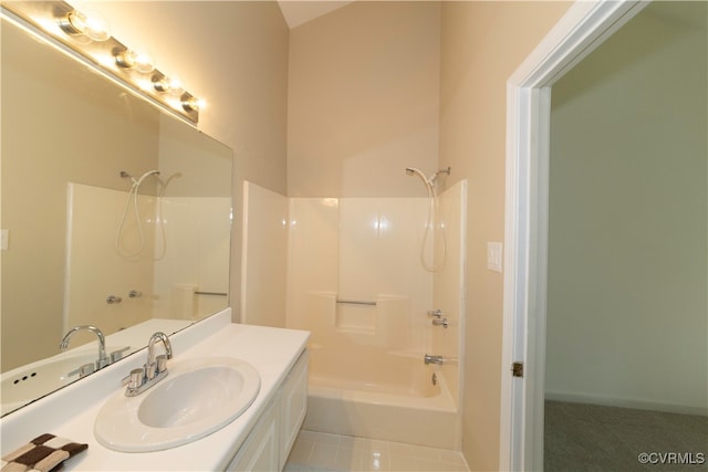 bathroom with tile patterned floors, vanity, and washtub / shower combination