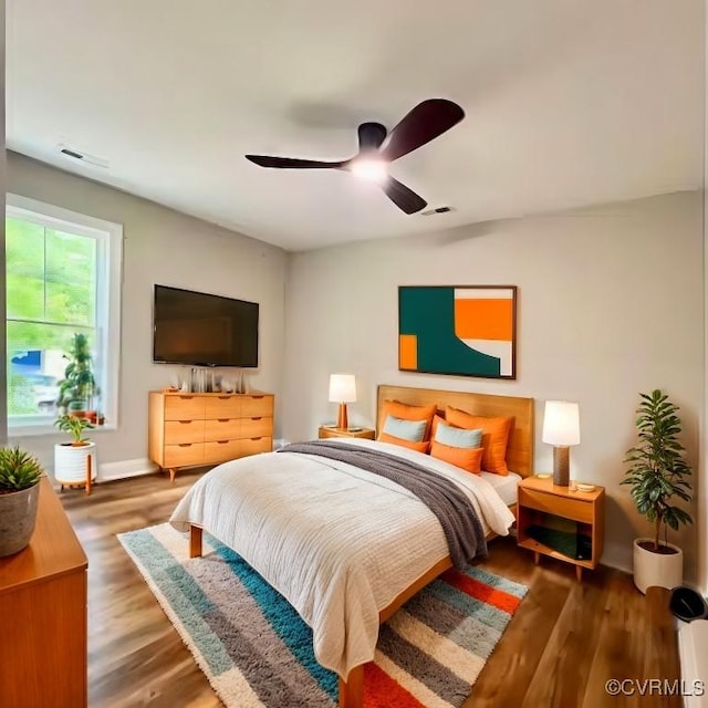 bedroom featuring ceiling fan and hardwood / wood-style flooring