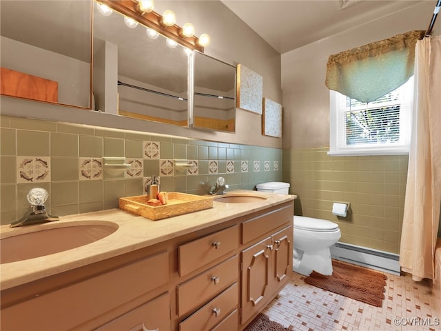 bathroom featuring toilet, tile walls, a baseboard heating unit, vanity, and a shower with curtain