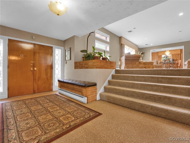 carpeted entrance foyer with a baseboard radiator