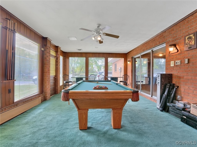 recreation room with light carpet, wooden walls, and plenty of natural light