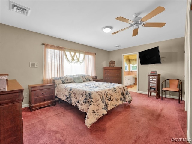 bedroom with ceiling fan, carpet floors, connected bathroom, and multiple windows