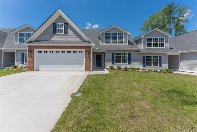 view of front of house featuring a garage and a front yard