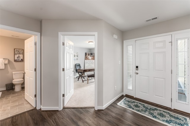 entrance foyer featuring dark hardwood / wood-style floors