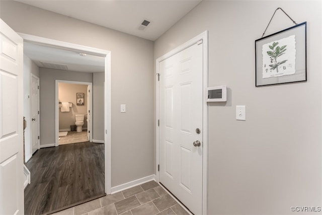 entryway with wood-type flooring