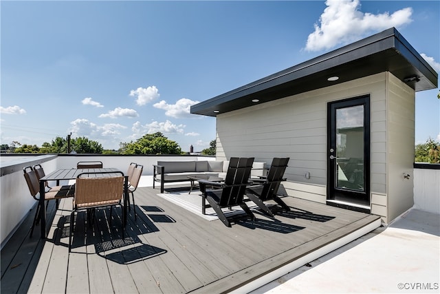 wooden terrace featuring outdoor lounge area