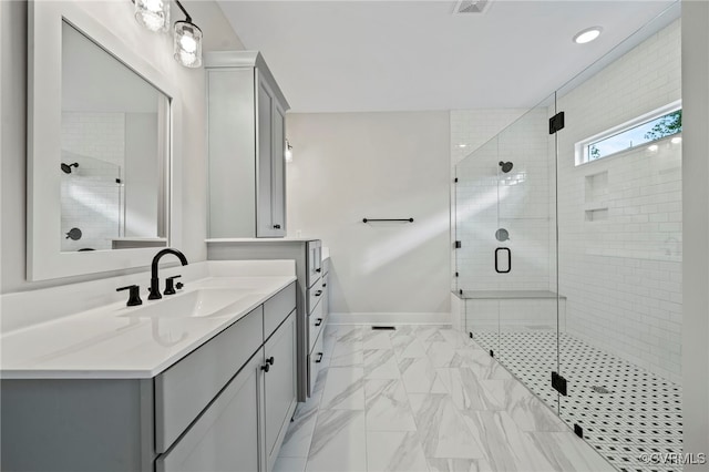 bathroom featuring walk in shower and vanity