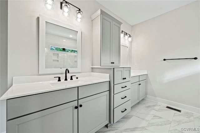 bathroom with walk in shower and vanity