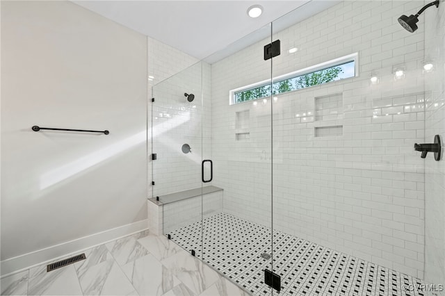 bathroom with a shower with shower door