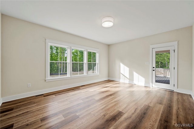 spare room featuring hardwood / wood-style floors