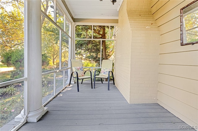 unfurnished sunroom with wooden ceiling