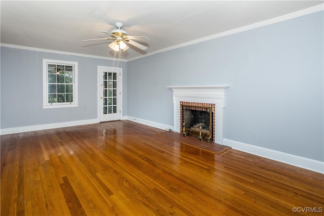 unfurnished living room featuring ornamental molding, hardwood / wood-style floors, ceiling fan, and a brick fireplace