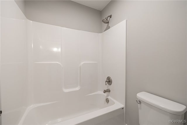 bathroom with toilet and shower / bathing tub combination