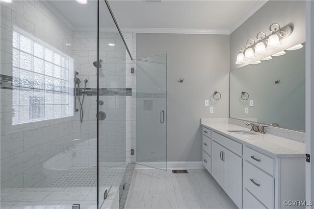 bathroom featuring a shower with door, vanity, and crown molding